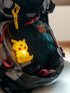 Figurine lumineuse Pokémon Pikachu assis avec dragonne