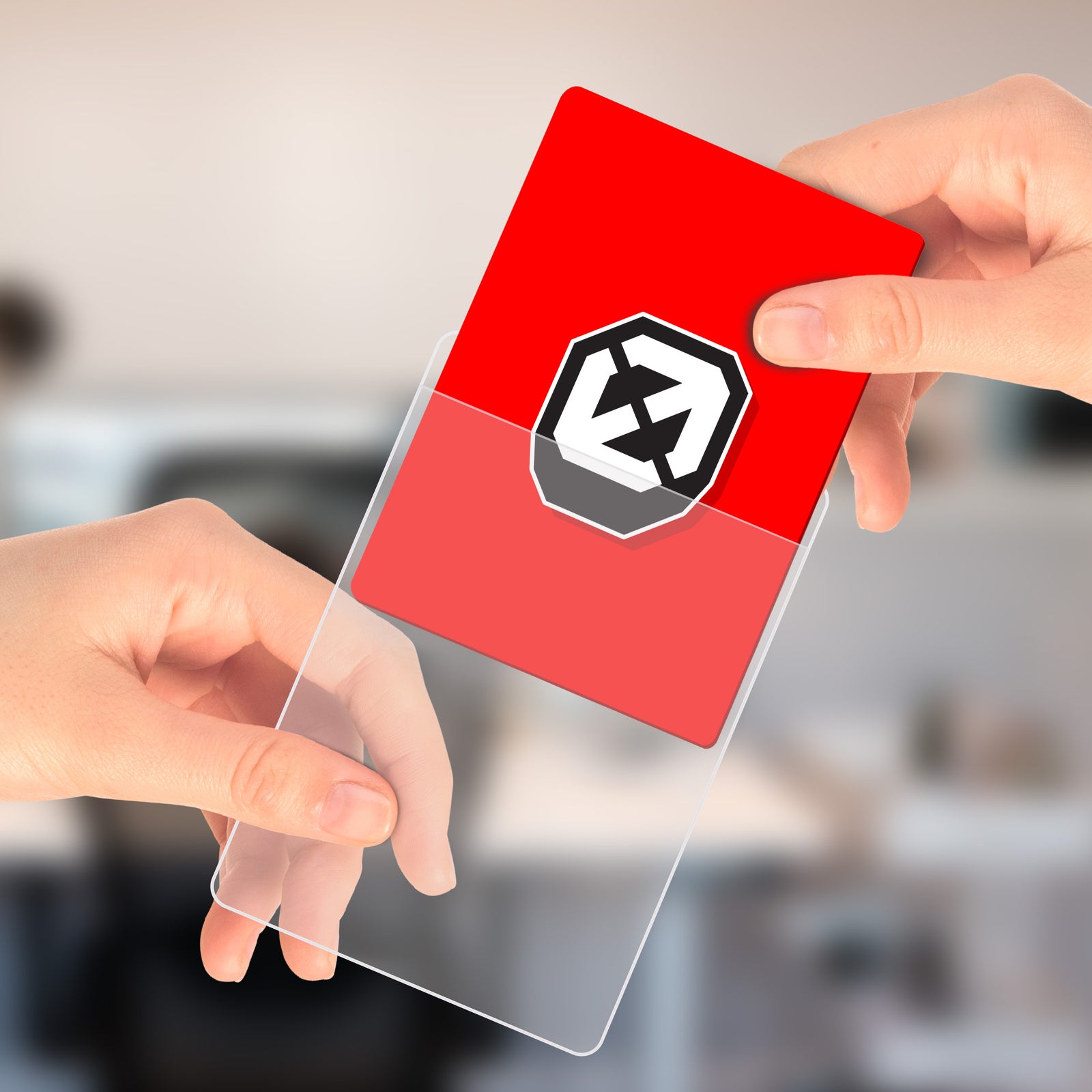 Hands inserting a red EVORETRO card into a semi-rigid card saver sleeve with a blurred background.