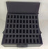 Black foam-lined storage case with multiple compartments on a white background