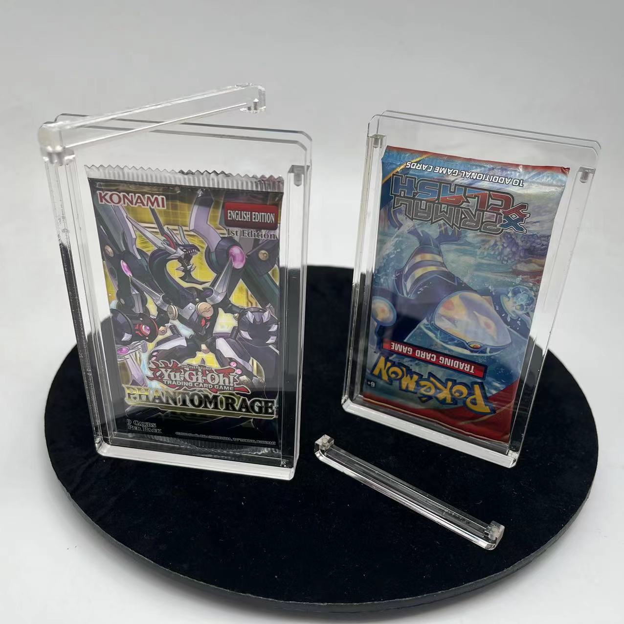 EVORETRO magnetic acrylic booster pack case displaying sealed trading card packs with open lid on stand