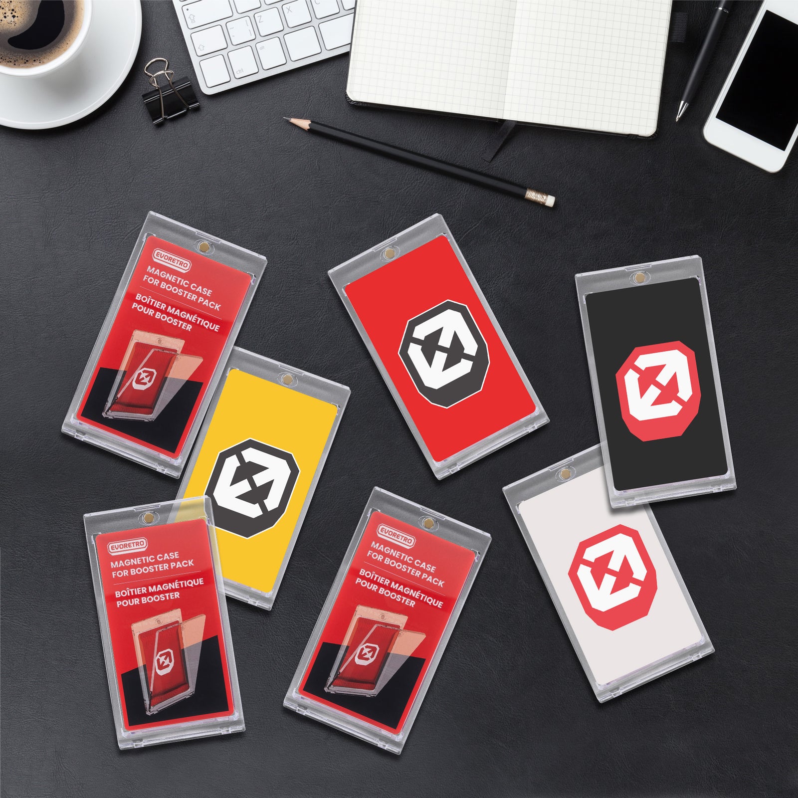 Set of EVORETRO magnetic booster pack holders on a desk with office supplies in the background.