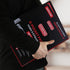 Person holding a black and red EVORETRO 9-pocket page packaging