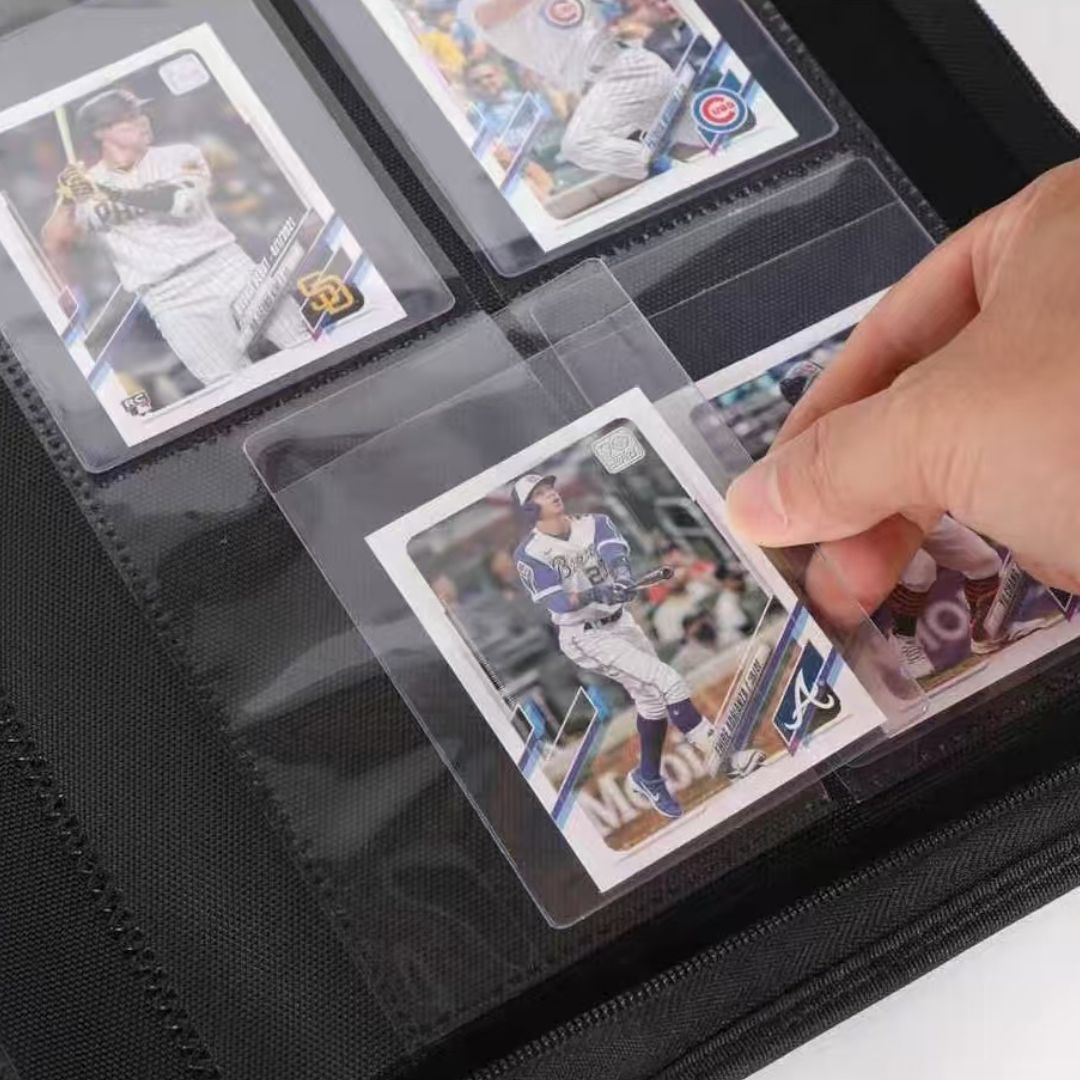 Collector placing a trading card in a semi-rigid holder into a clear binder pocket