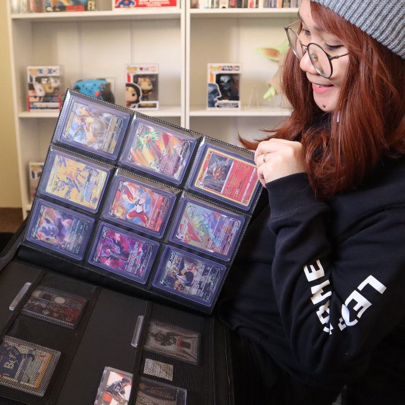 Collector using black 3x3 toploader binder to organize trading cards in protective sleeves