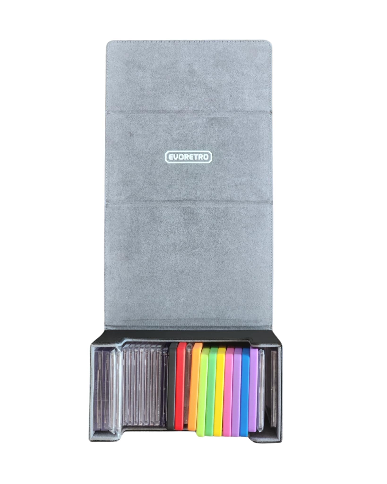 Top view of black waterproof screwdown graded card holder with gray interior, showing colorful cards in compartments