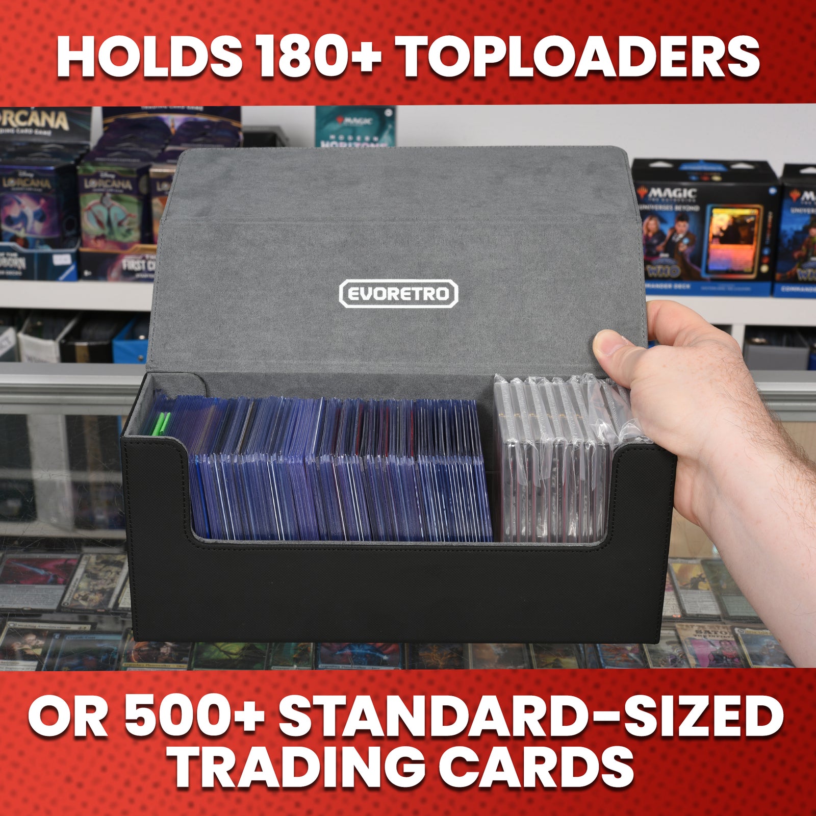 A hand holding the lid open of a magnetic card holder filled with toploader cards and a graded card inside