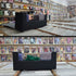 Black open magnetic card holder placed on comic book boxes inside a comic store, filled with cards and collectibles, with comic book wall display in the background