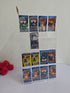 Collection of Pokémon trading cards displayed on a clear acrylic stand with a white background.