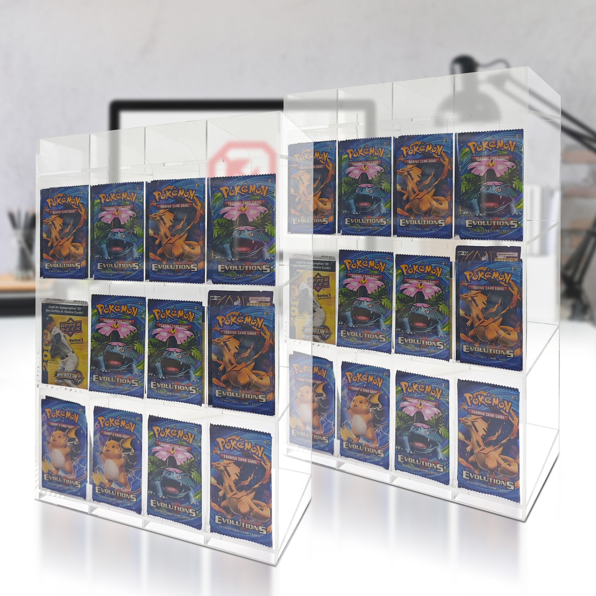 Collection of Pokémon trading cards in a clear acrylic display case.