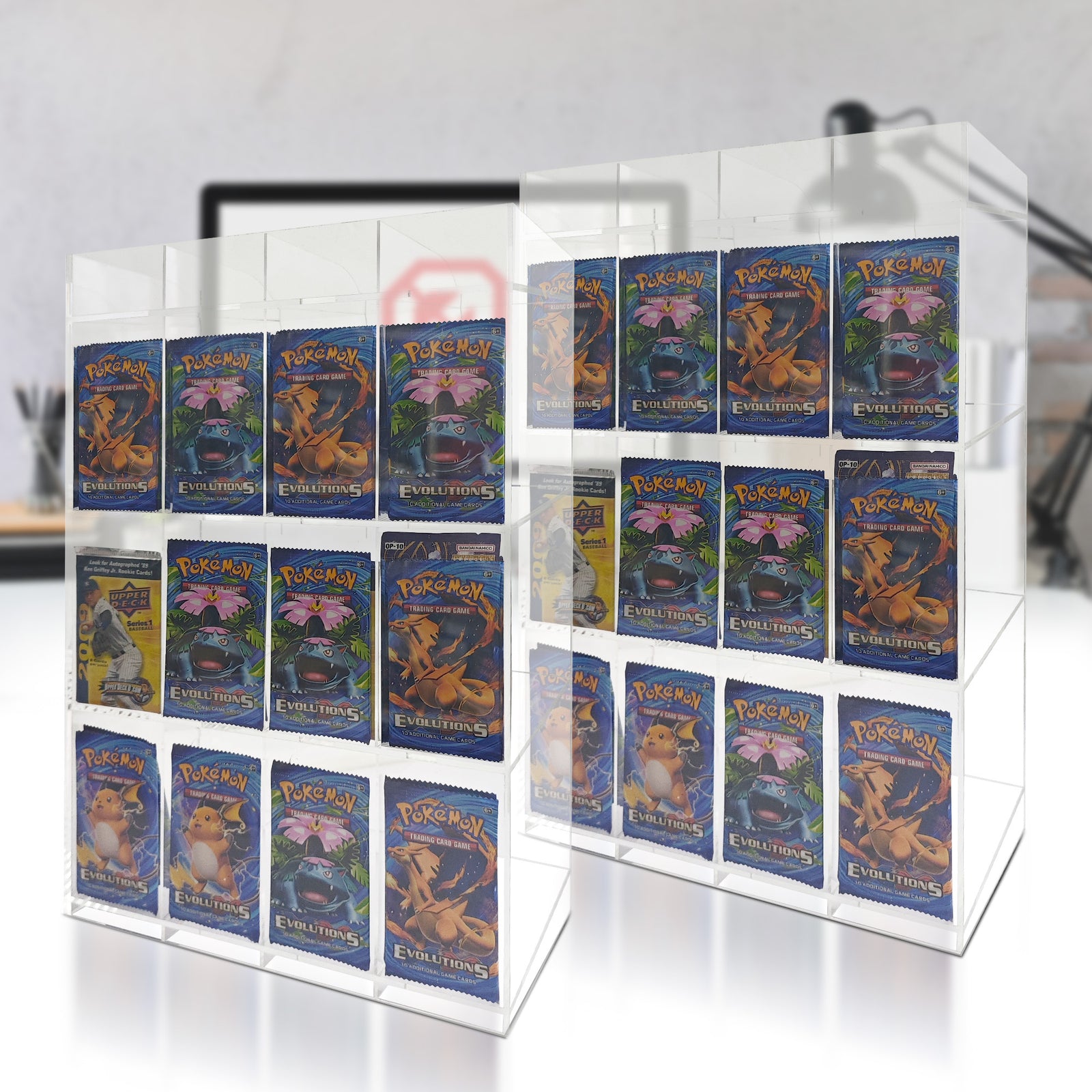 Collection of Pokémon trading cards in a clear acrylic display case.