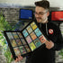 Collector holding open 9 pocket zip up trading card binder displaying organized card collection