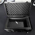 Black metal case with foam lining shown on a black surface