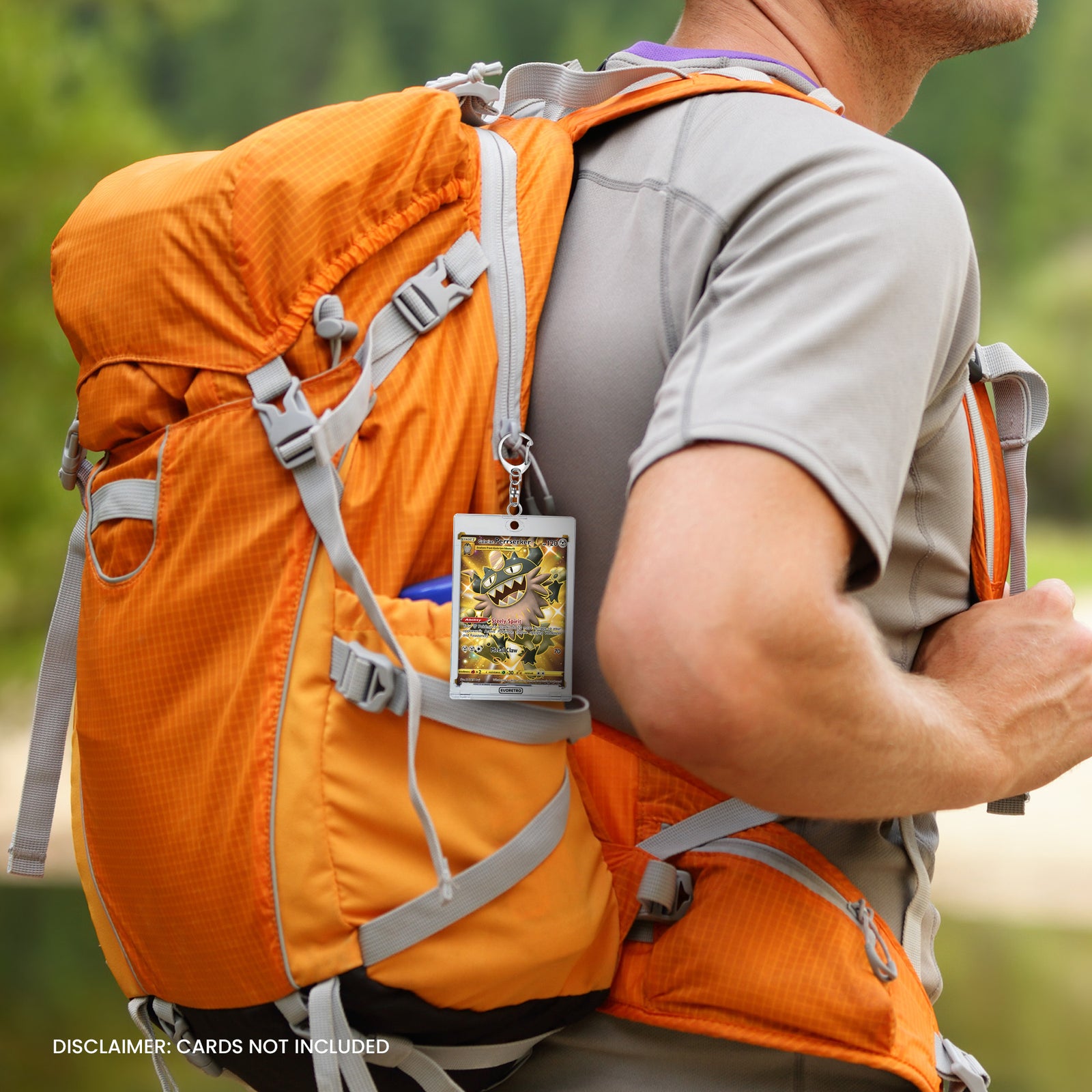Person wearing an orange backpack with a card holder attached, outdoors.