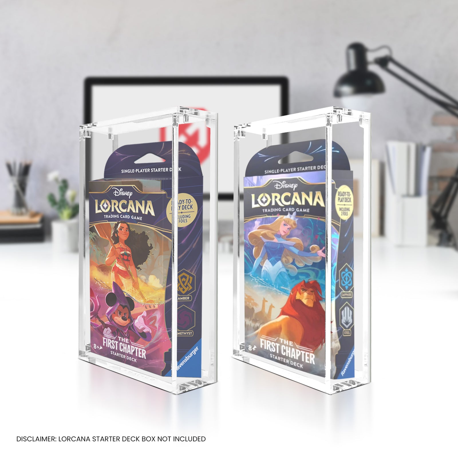 Two Disney Lorcana trading card game starter decks in clear display cases on a desk.