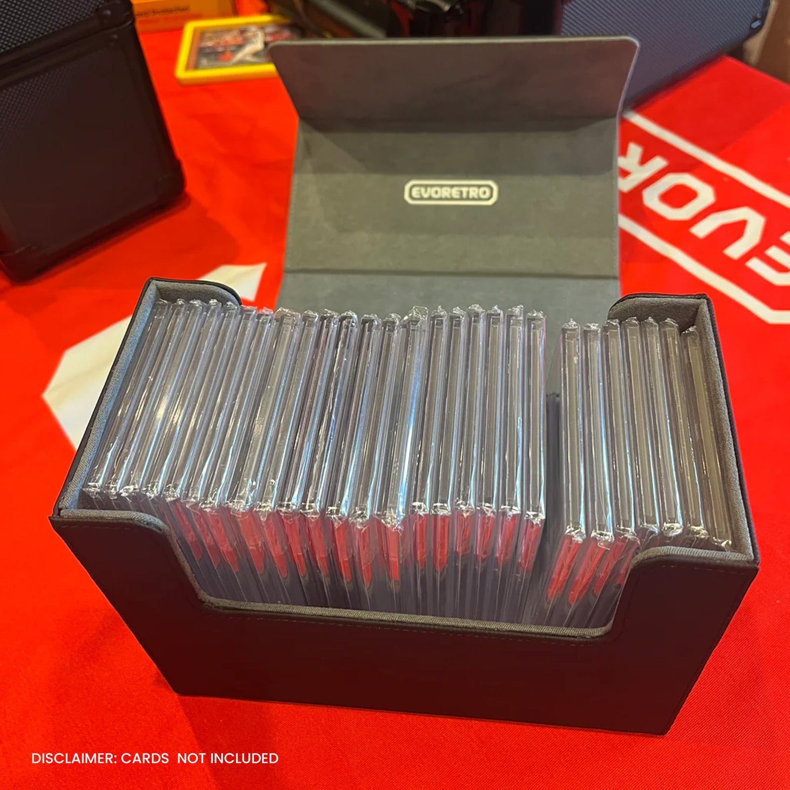Collection of cards in a black box with EVORETRO branding on a red surface.