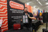 Eric showcasing EVORETRO slab binder at the event, front-facing view with sports cards displayed in the card slots.
