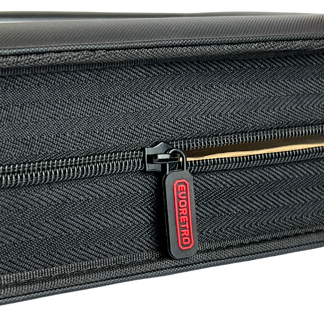 Partially unzipped slab binder showing secure zipper and durable textured edge