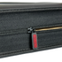 Partially unzipped slab binder showing secure zipper and durable textured edge